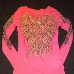 Long sleeve light pink shirt.